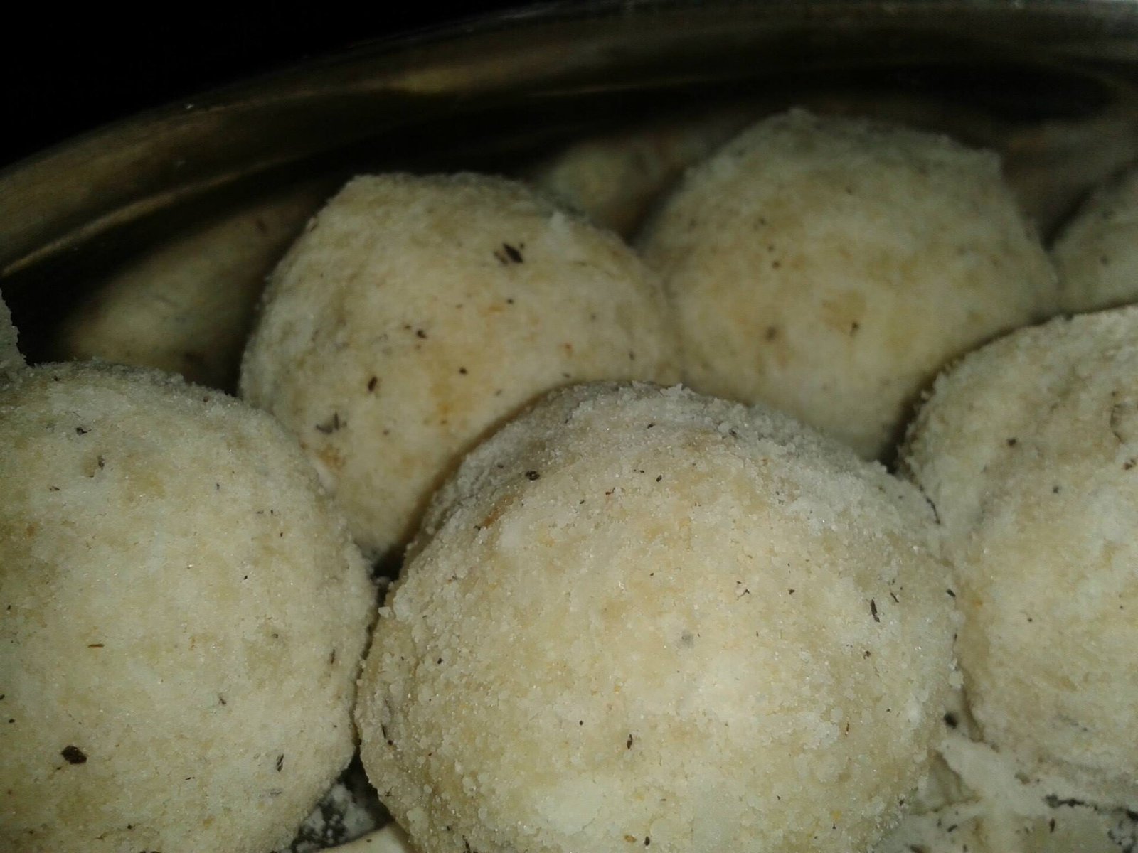 Rava ladu with raisins and almond slivers